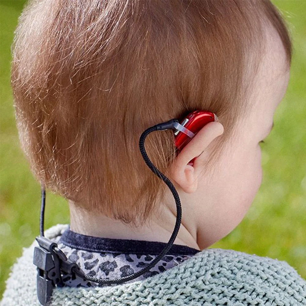 Oticon kids safeline retention cord shown on a child