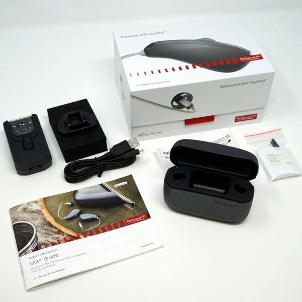 Linx Quattro Charging case for hearing aids with accessories all laid out from package on white background