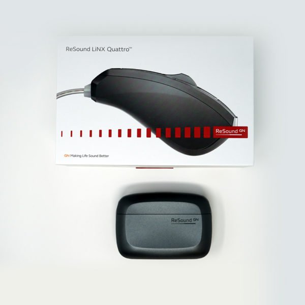 Flat down image showing Linx Quattro charger with packaging on white background