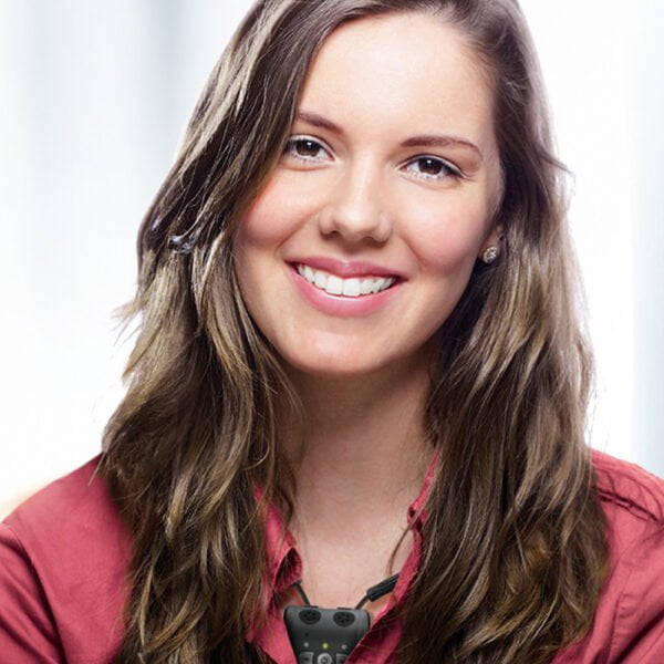 Brown Haired Young Woman Wearing Bellman & Symfon Audio Neck Loop